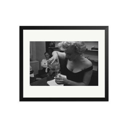 Marilyn Monroe Pouring A Drink Framed Print Black Large